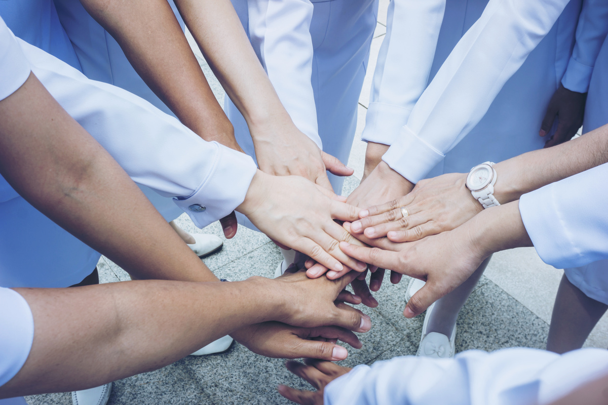 Doctors and Nurses Stacking Hands