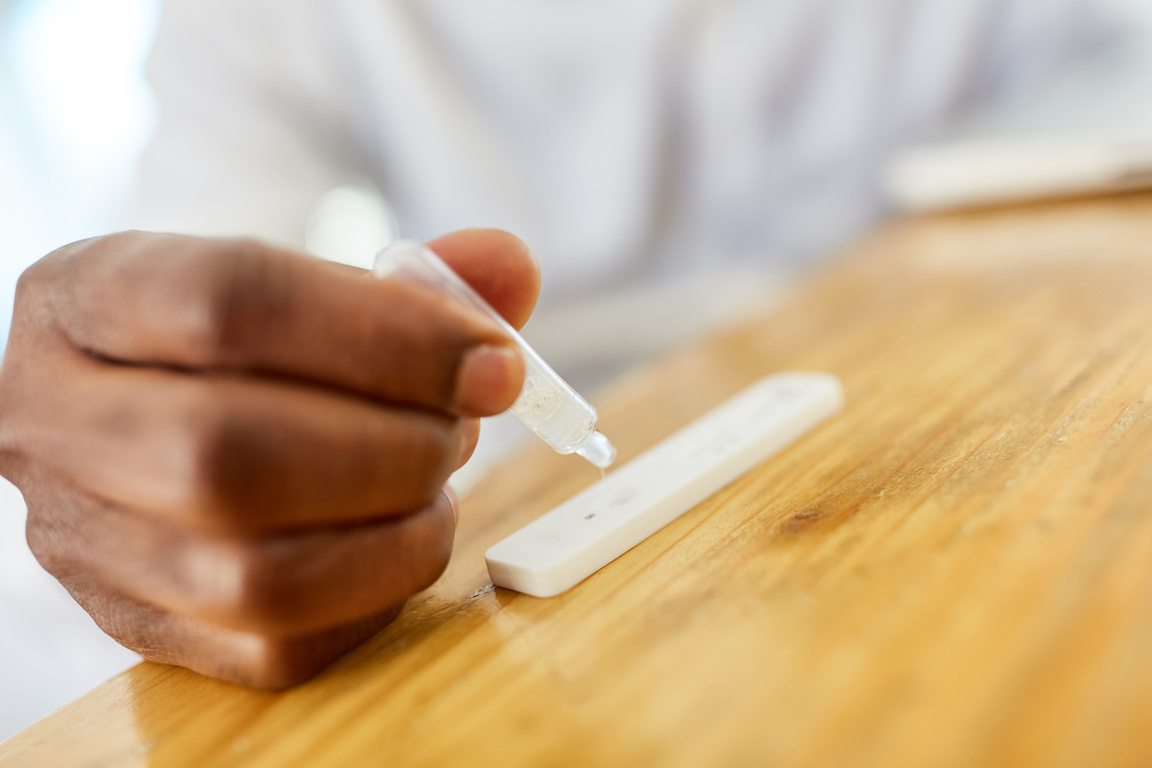 Hand with Saliva Sample during the Covid-19 Antigen Test